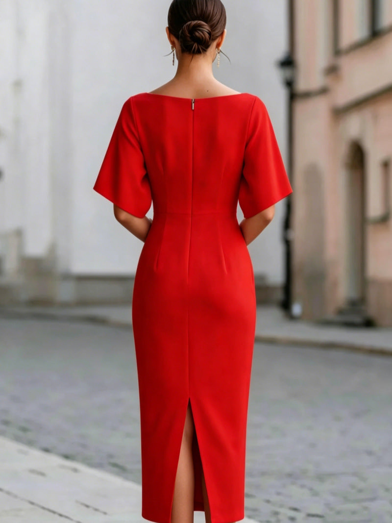 Back of a red midi pencil dress with a center back zip and a back slit