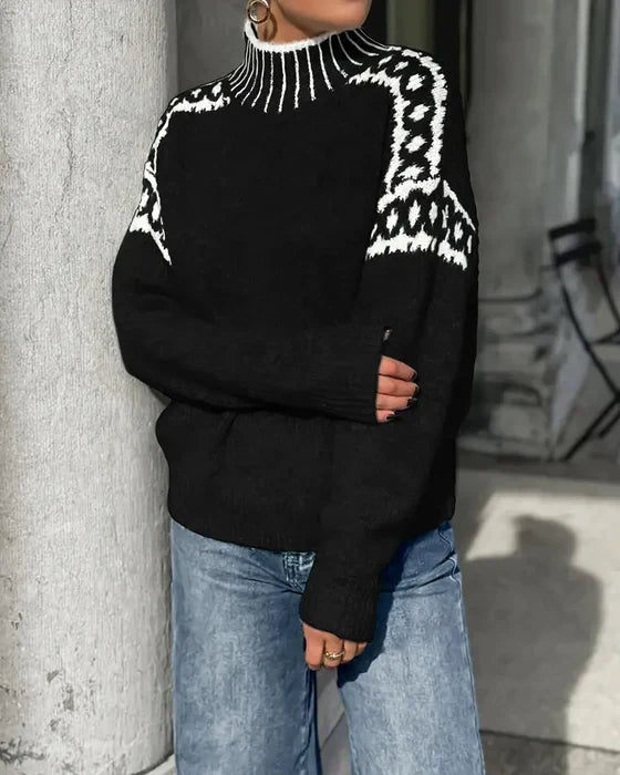 Black patterned yoke sweater worn with wide leg jeans