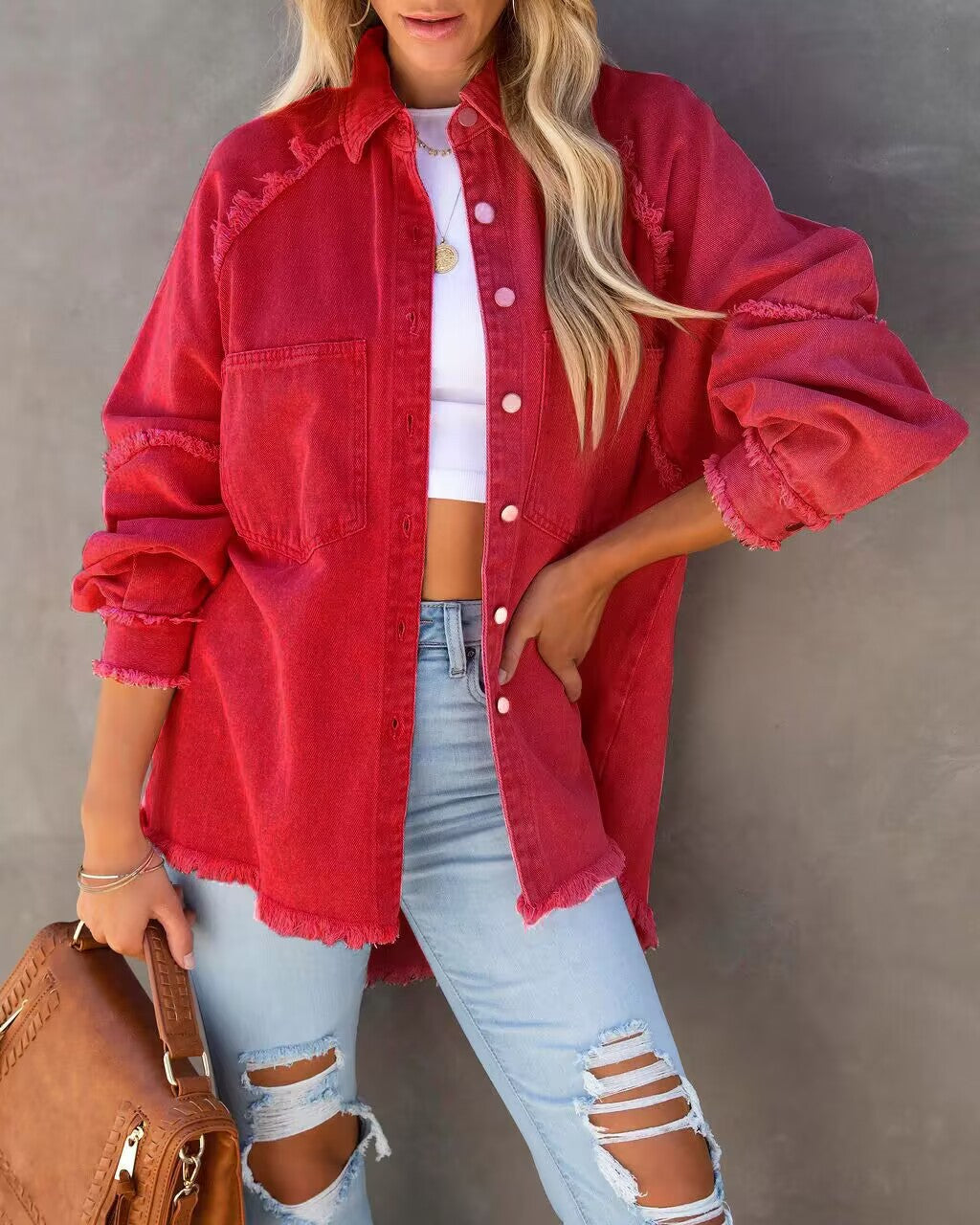 Red oversized frayed denim shirt jacket worn with ripped jeans