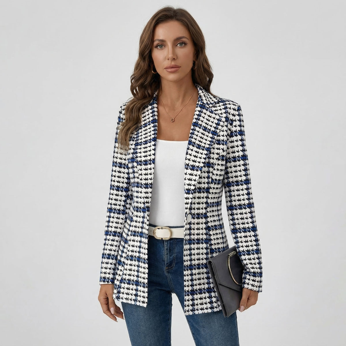 Navy and cream houndstooth tweed blazer worn over jeans