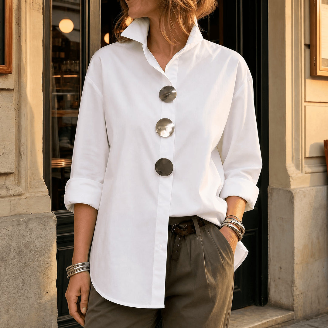 White asymmetric button front blouse with oversized round buttons, front view