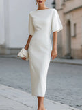White midi pencil dress with a boat neckline and wide elbow length dolman sleeves