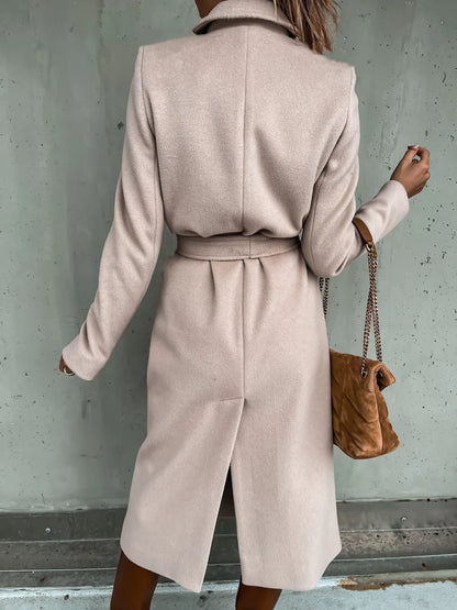 Back view of the beige belted shawl collar coat