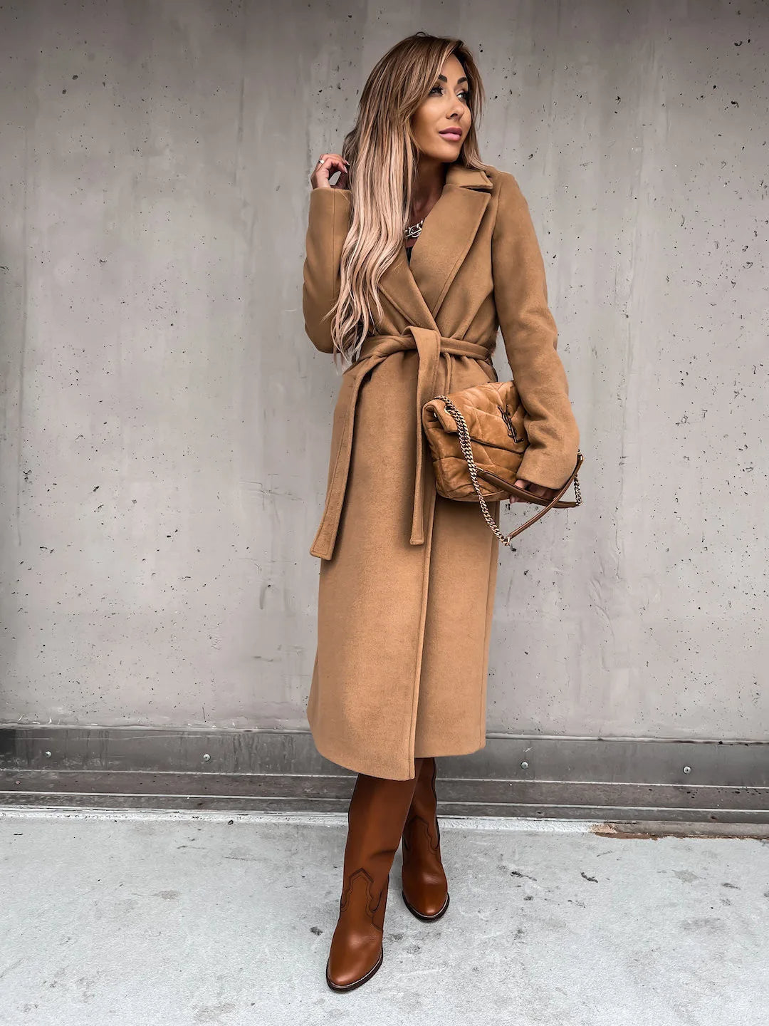 Khaki belted shawl collar coat worn with brown boots