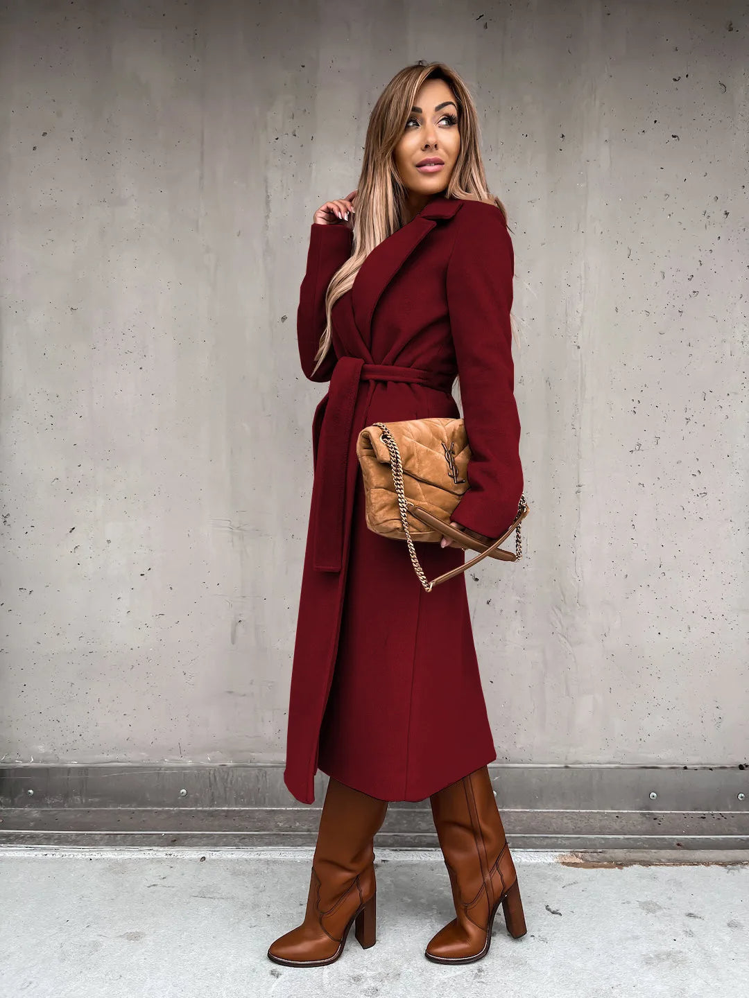 Burgundy belted shawl collar coat worn with brown boots