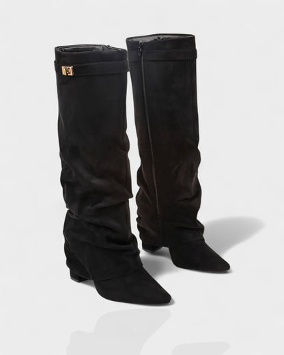 Pair of black suede foldover knee boots at a three quarter angle