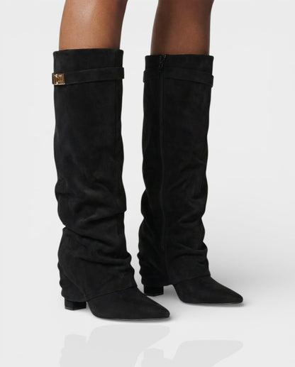 Black suede foldover knee boots worn with bare legs, front angle