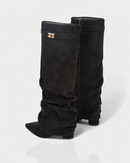 Black suede foldover knee boots seen from behind the heel
