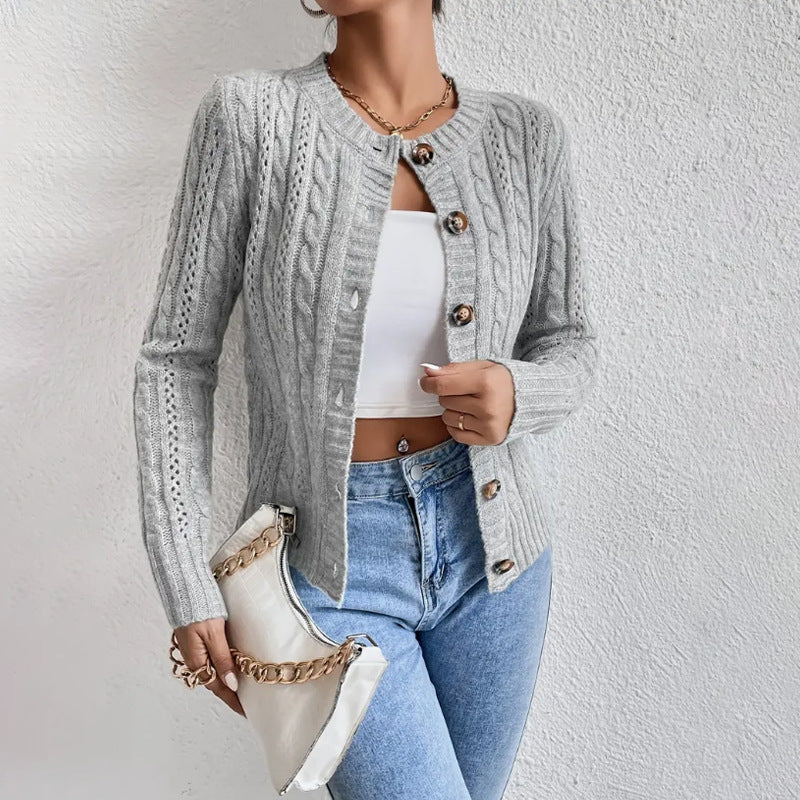 Grey cable knit cropped cardigan worn with jeans
