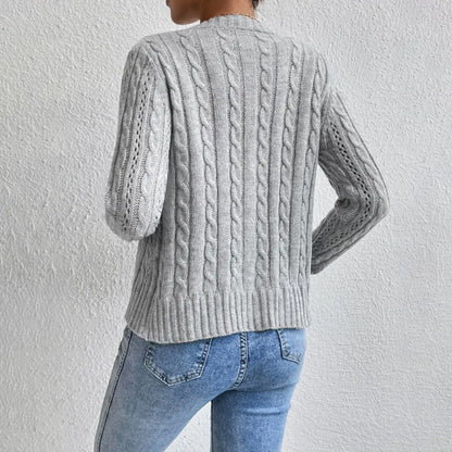 Grey cable knit cardigan worn, back view
