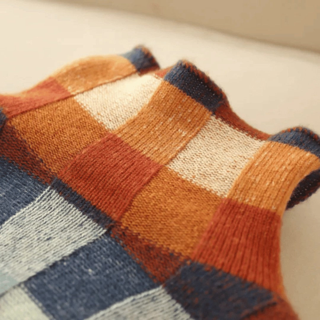 Checkerboard knit turtleneck collar laid flat
