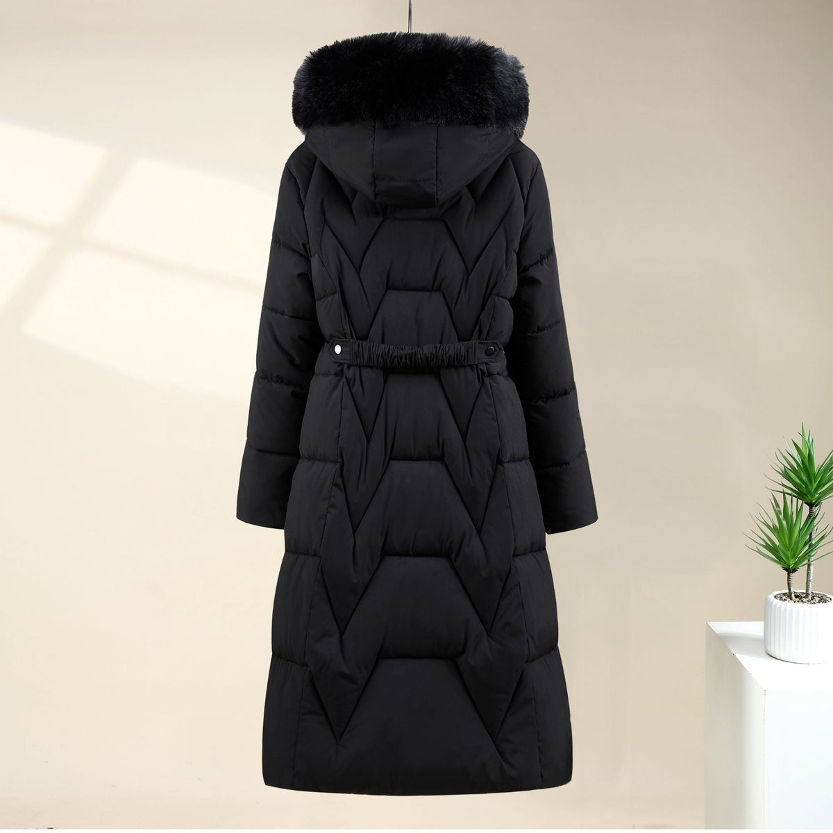 Black chevron quilted long parka with hood up, back view