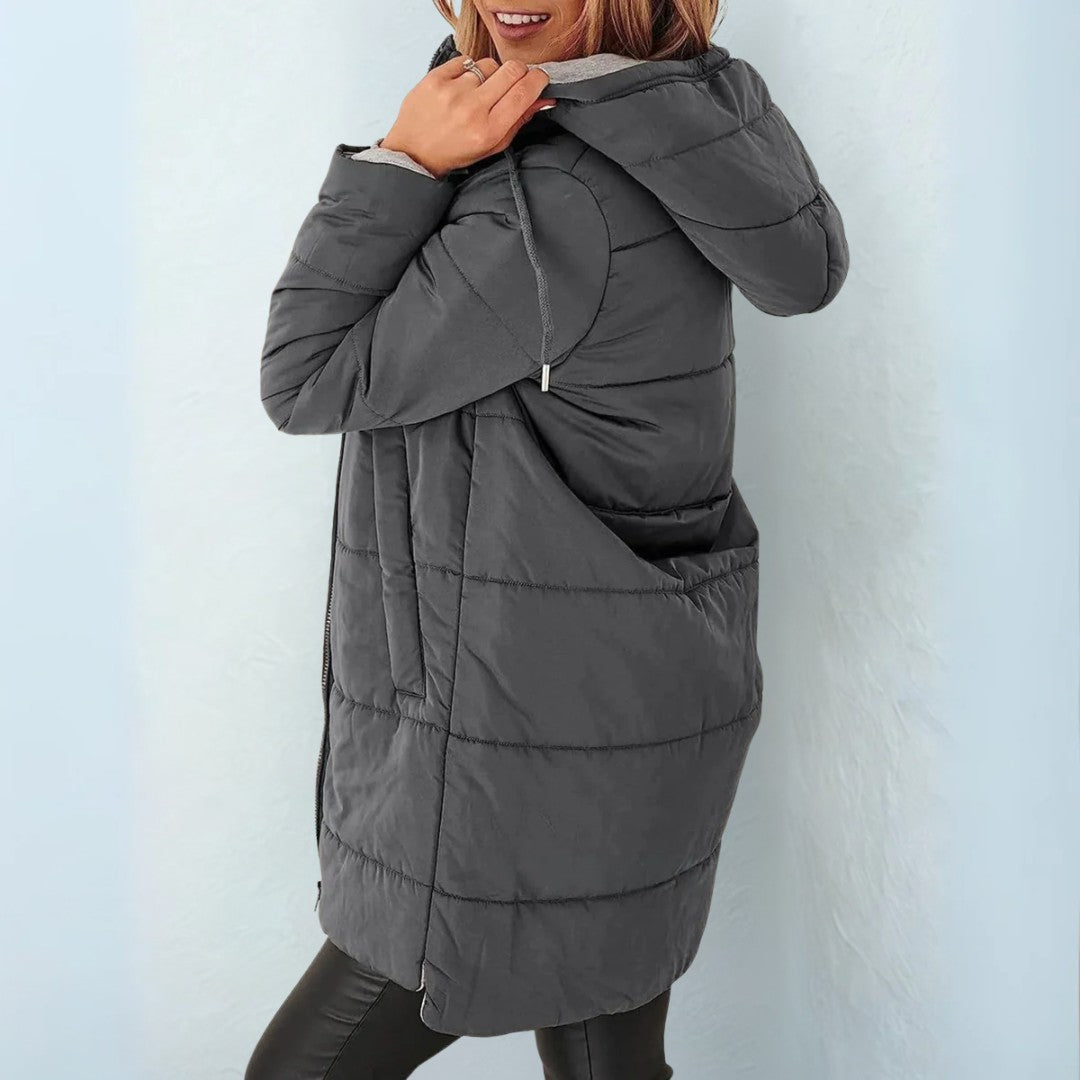 Dark gray quilted hooded coat, side view showing the pocket and hem