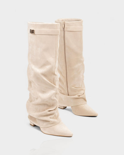 Cream suede foldover knee boots with the side zip in view