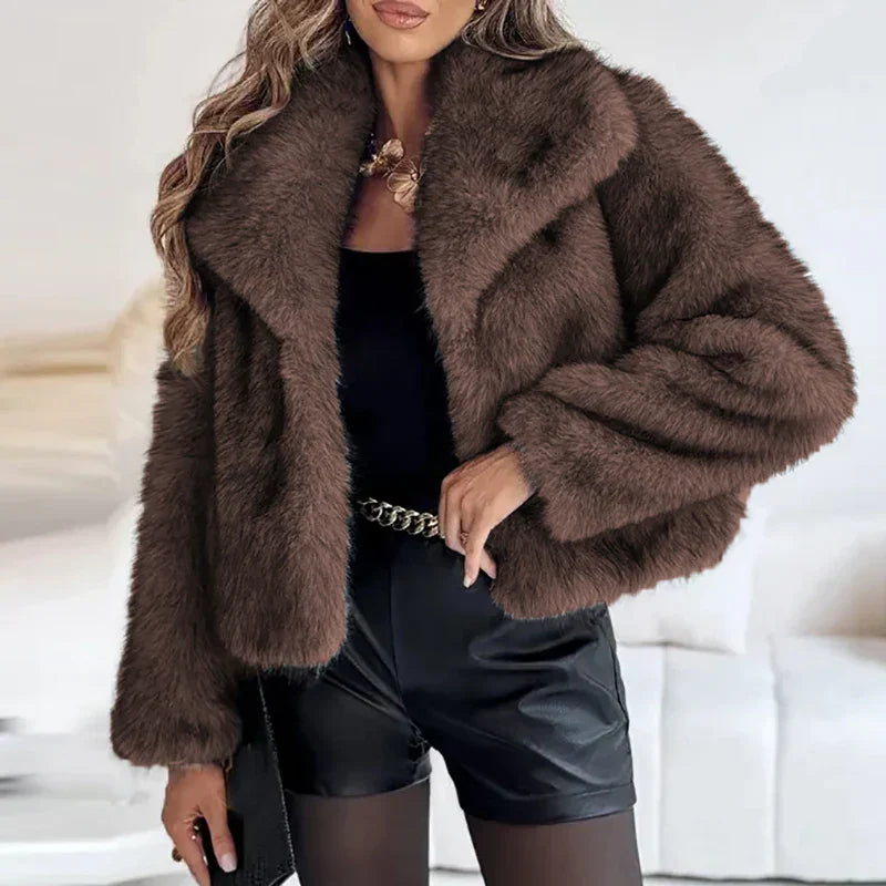 Brown cropped faux fur jacket worn with shorts