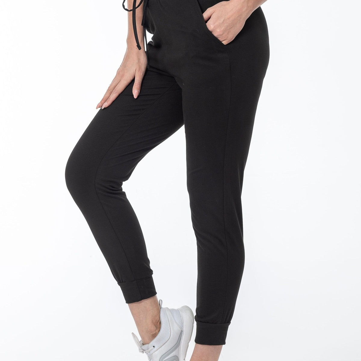 Black cuffed joggers, close side view