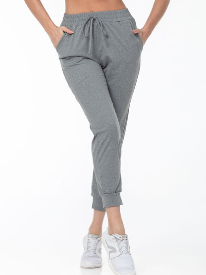 Gray drawstring joggers with side pockets, front view