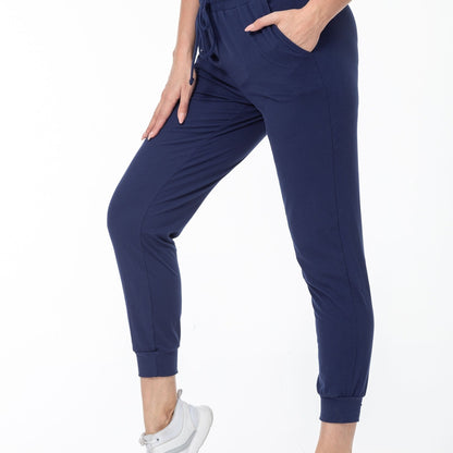 Navy cuffed joggers with a hand in the pocket