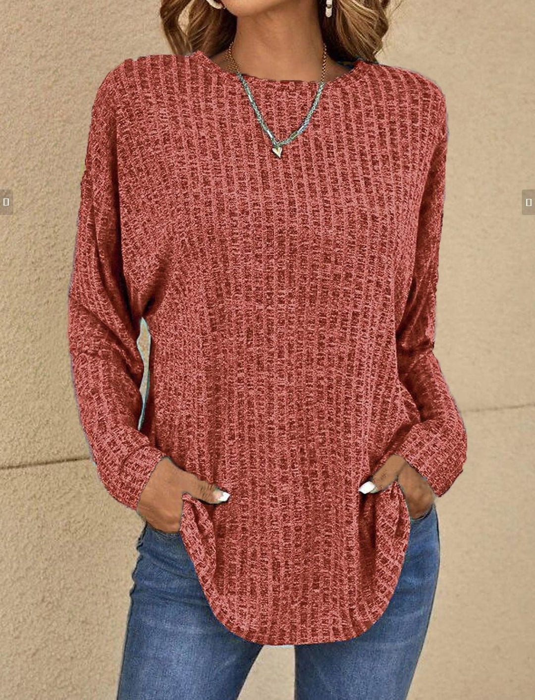 Rust curved hem rib sweater with jeans, front view