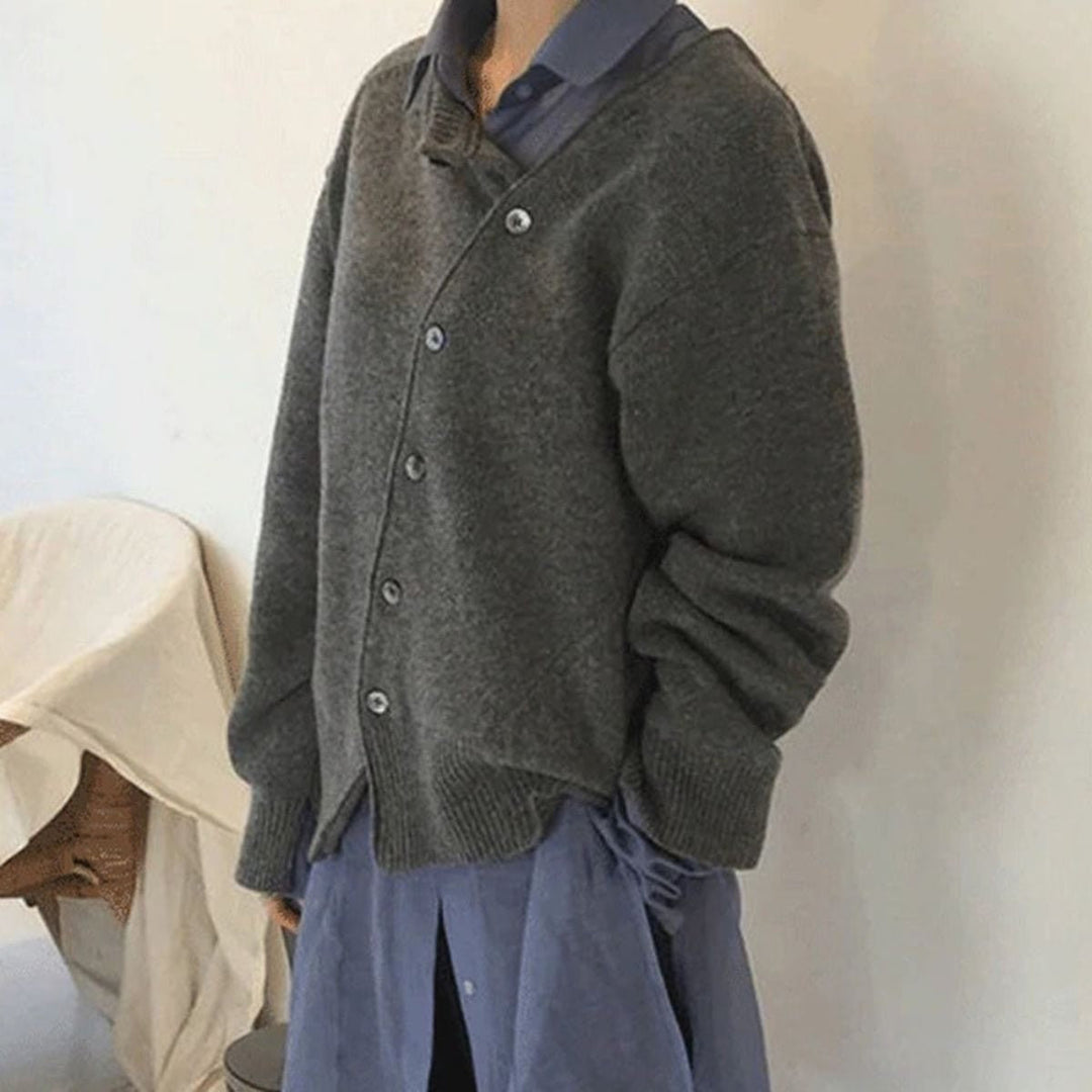Charcoal diagonal button knit cardigan over a long shirt, side view