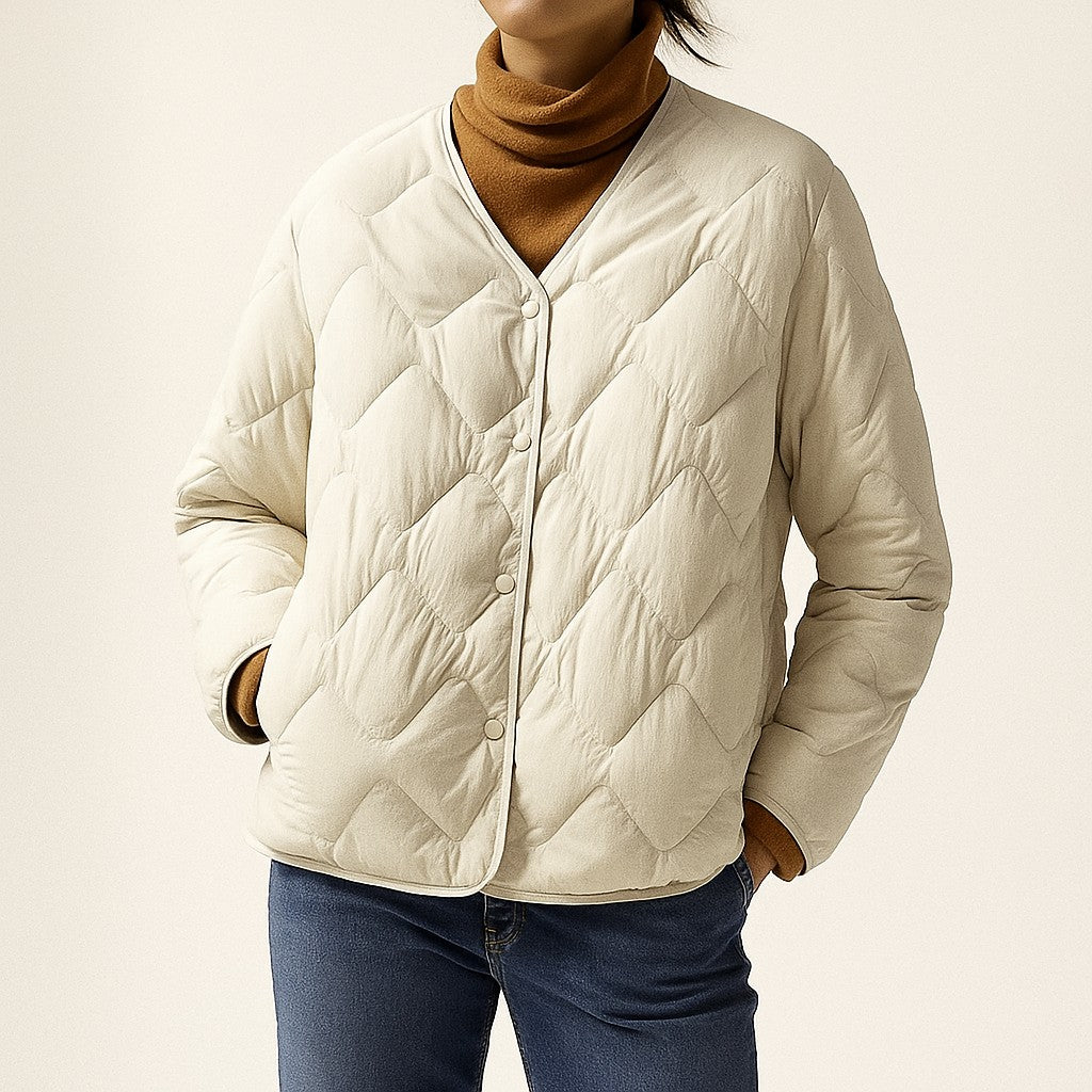 Cream diamond quilted jacket worn, front view