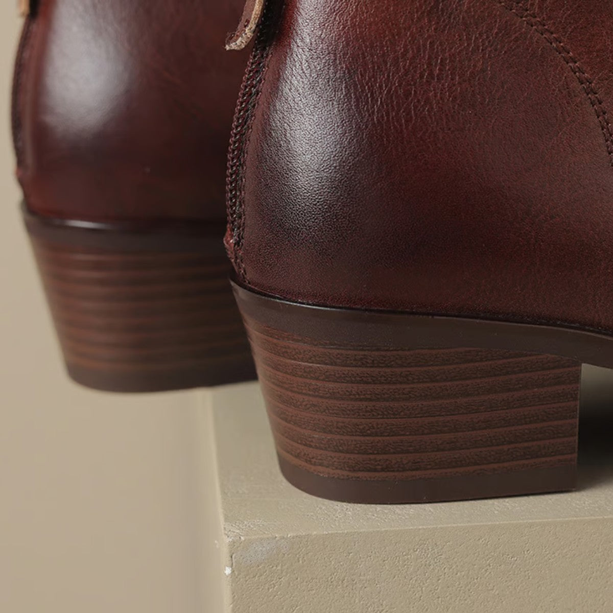 Close up of the wine boot stacked block heel and zip