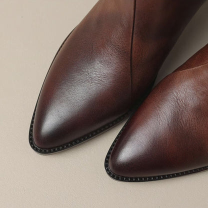 Close up of the wine boot pointed toes and welt edging