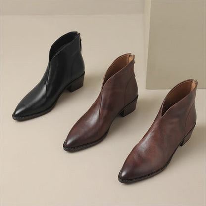 Black and wine V cut ankle boots side by side