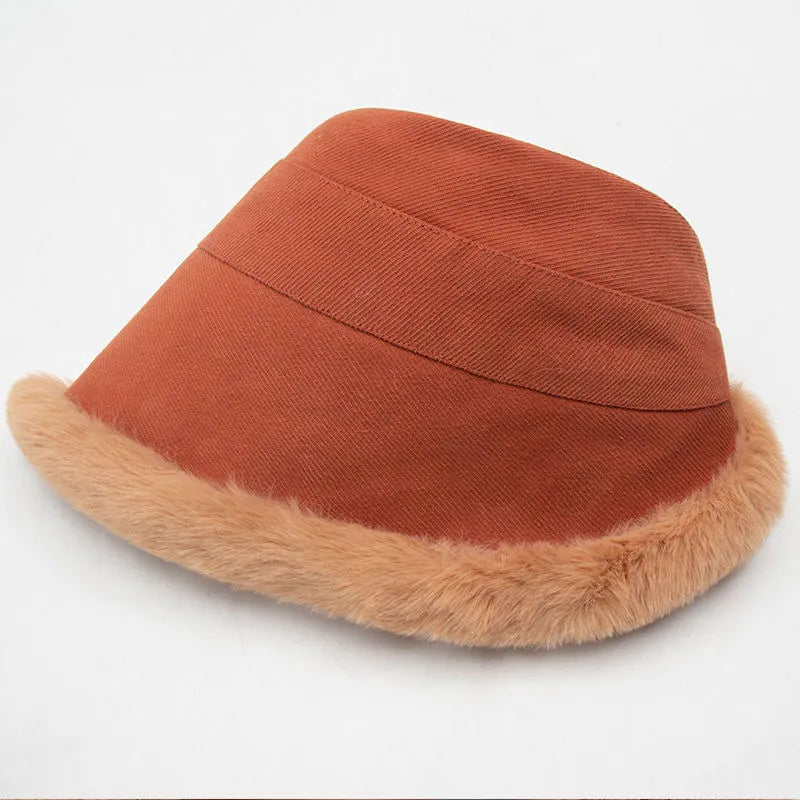 Rust orange fur brim bucket hat laid on its side