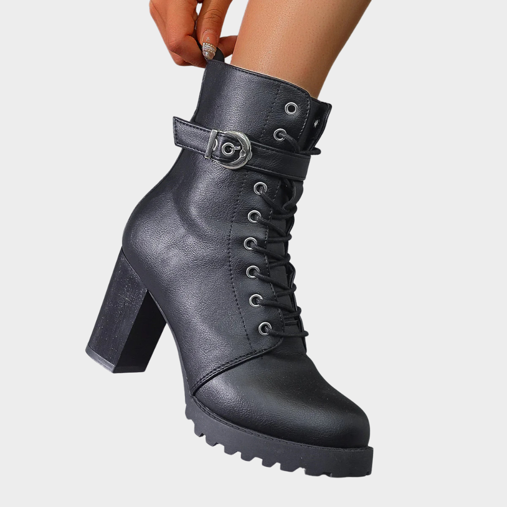 Black lace up combat boot with a block heel, side view