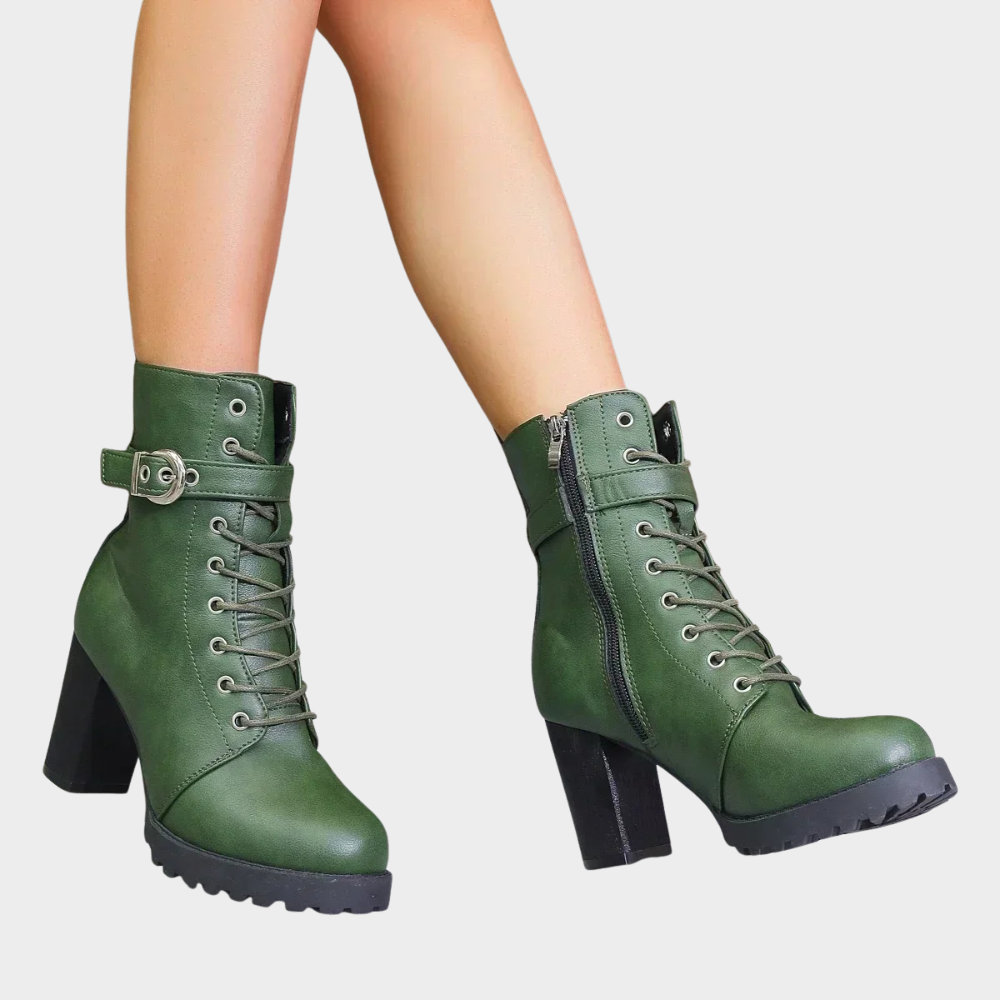 Green combat boots with a side zip worn walking