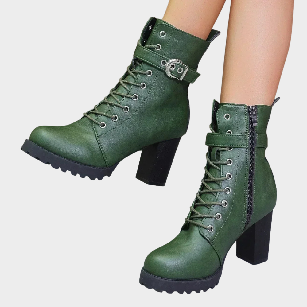 Green lace up combat boots with a buckle strap