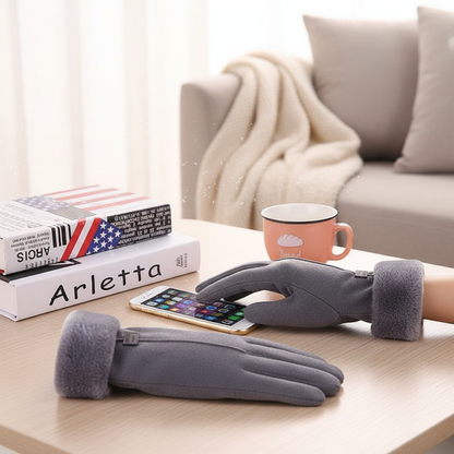 Gray fleece lined gloves used on a phone at a table