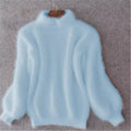 Light blue fluffy knit sweater with balloon sleeves on a hanger