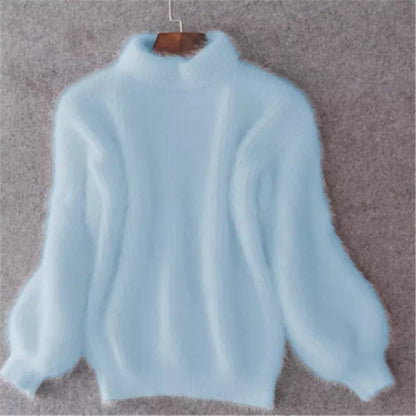 Light blue fluffy knit sweater with balloon sleeves on a hanger