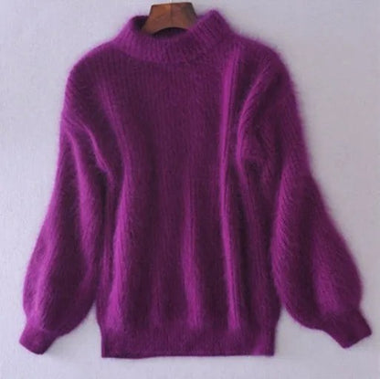 Purple fluffy knit sweater with ribbed cuffs on a hanger