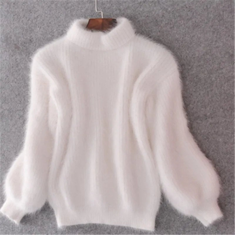 White fluffy knit sweater with stand collar on a hanger