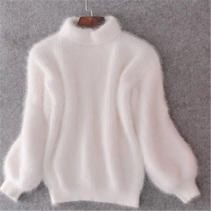 White fluffy knit sweater with stand collar on a hanger