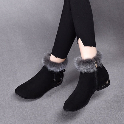 Black suede ankle booties with faux fur trim, worn