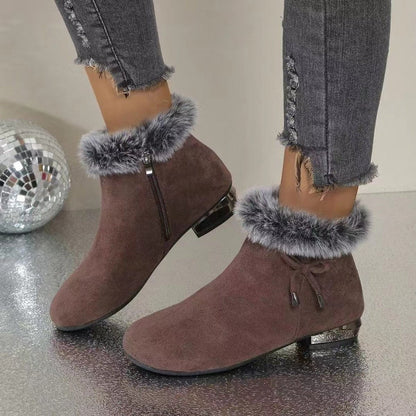 Brown suede booties with faux fur cuff and side zip, worn