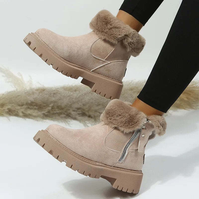 Beige fur cuff platform boots with side zip, angled view
