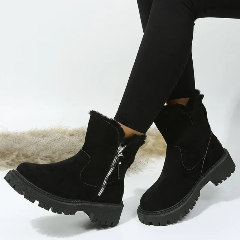 Black fur cuff platform boots worn with leggings, side view