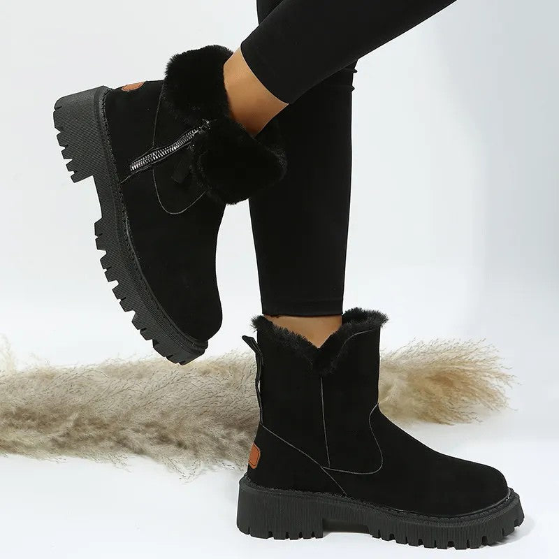 Black fur cuff platform boots with lug sole, angled view