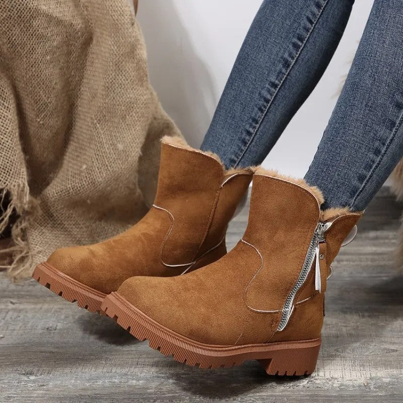 Camel fur cuff platform boots worn with jeans, side view