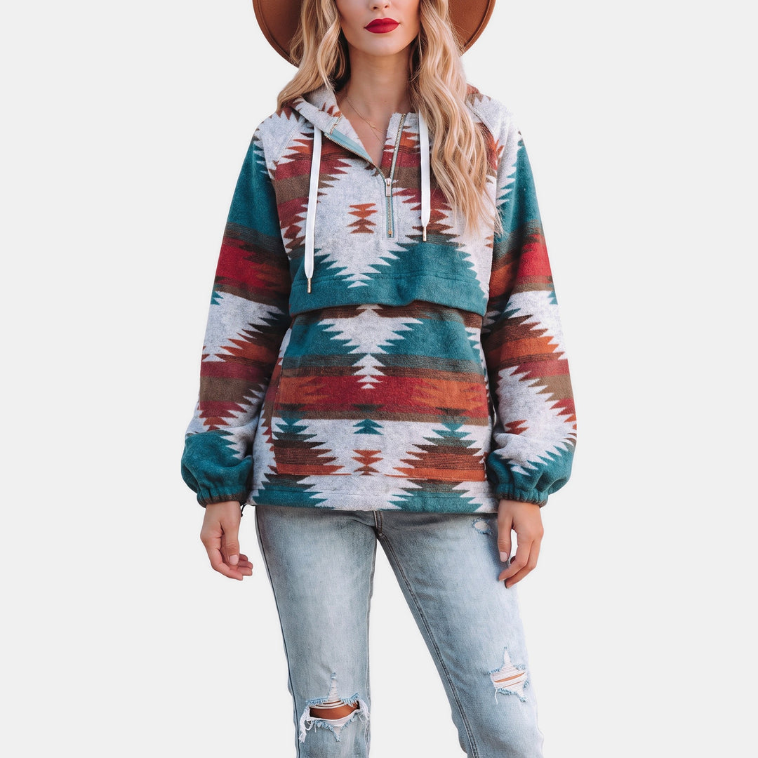 Teal and rust geometric print quarter zip hoodie with ripped jeans