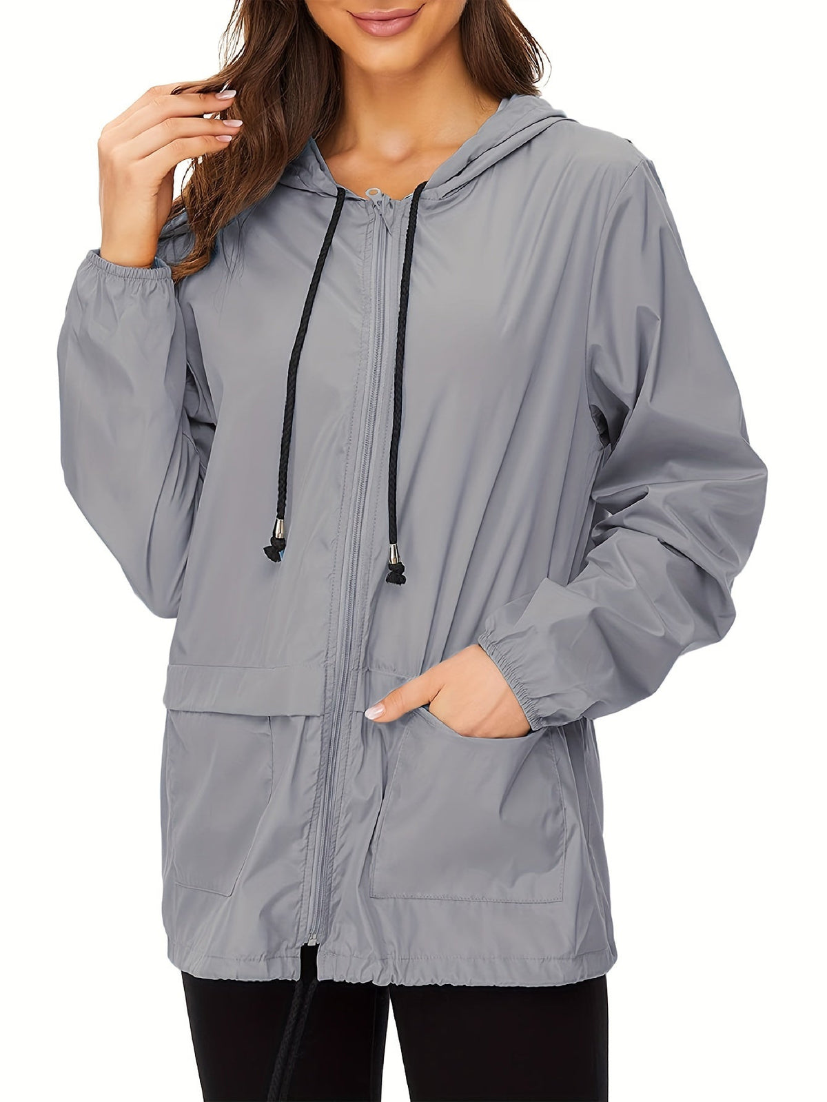 Gray hooded drawcord windbreaker worn on model