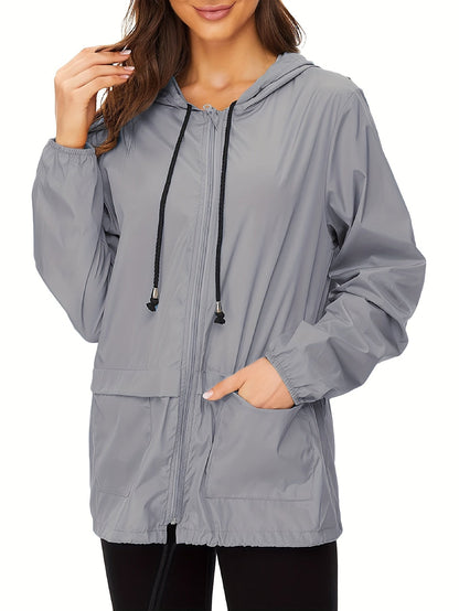 Gray hooded drawcord windbreaker worn on model
