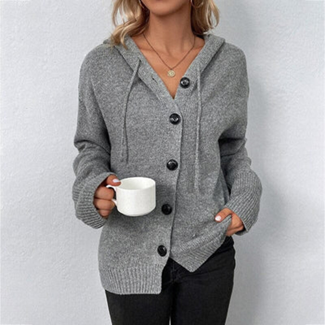 Grey hooded knit cardigan with drawstring hood, front view holding a mug