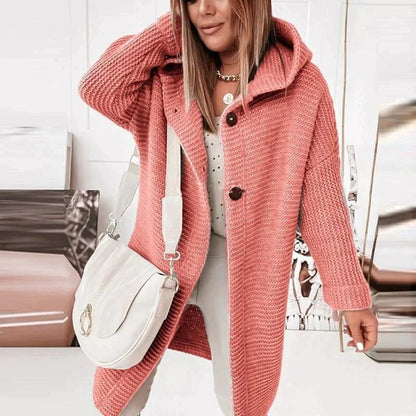 Coral hooded longline cardigan worn with white pants, front view