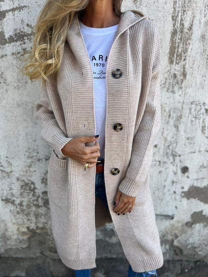 Beige hooded longline cardigan buttoned over a printed tee, front view